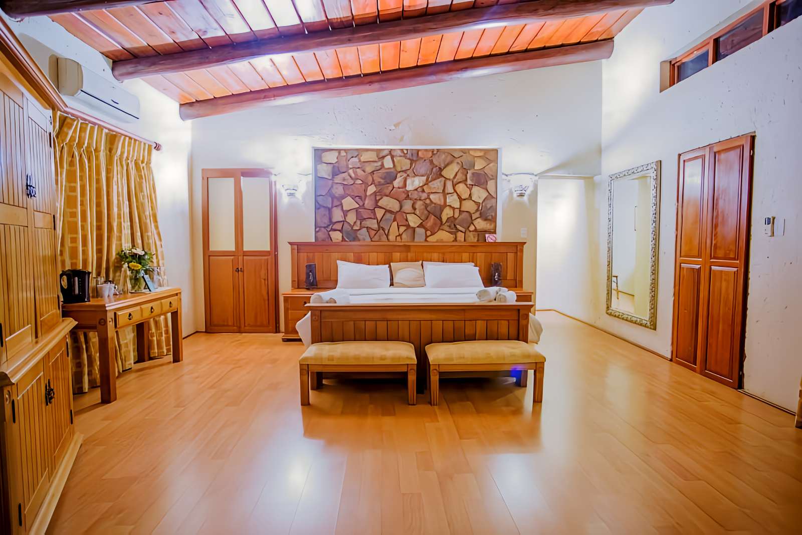 Spacious bedroom in Heritage Lodge Jacuzzi Suite